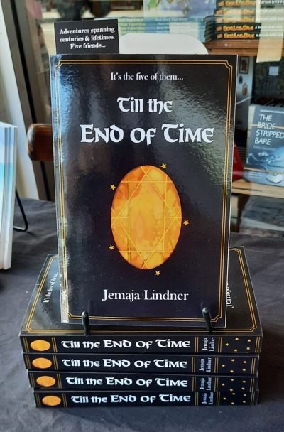 A stack of Till the End of Time books